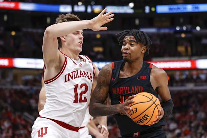 Maryland Terrapins guard Hakim Hart (13) drives to the basket against Indiana Hoosiers forward Miller Kopp (12) during the first half at United Center.